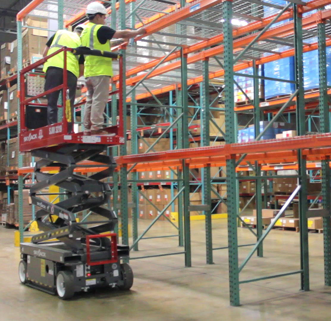 Installing labels from a scissor lift 