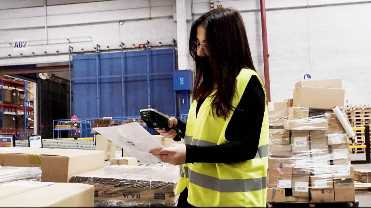 Women in a warehouse using a hand scanner